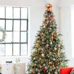 Scrap yarn is great to make a colorful pom pom Christmas tree topper